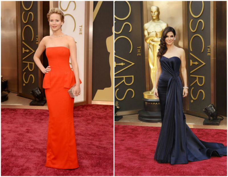 Jennifer Lawrence chega - Vestido de alta costura Dior vermelho e jóias Neil Lane.
<br />
Sandra Bullock - vestido azul marinho Alexander McQueen com jóias Lorraine Schwartz